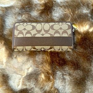 Coach signature “C” leather and canvas zipper wallet